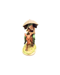 Man Riding Donkey Figurine