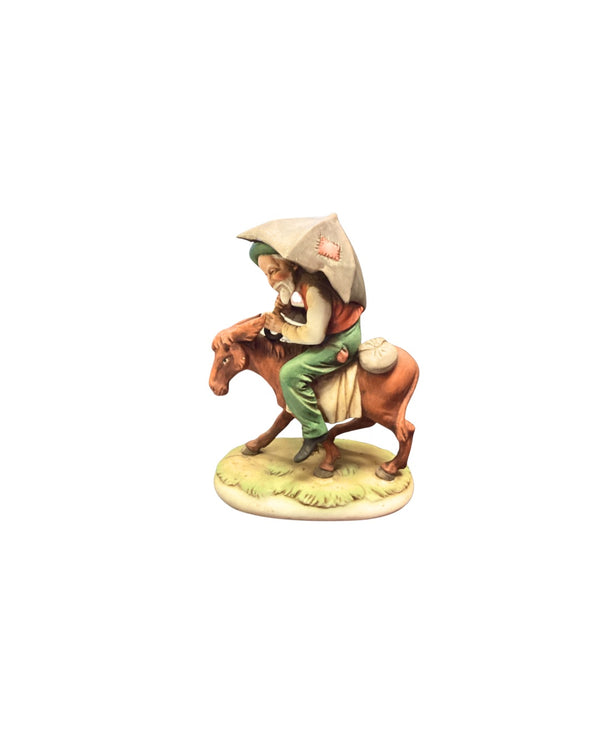 Man Riding Donkey Figurine