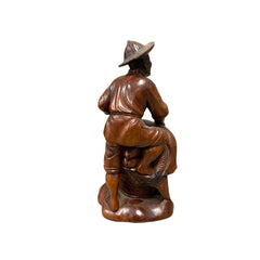Carved Fisherman Statue