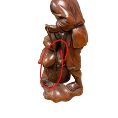 Carved Fisherman Statue