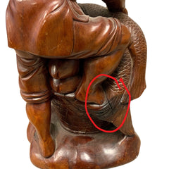 Carved Fisherman Statue